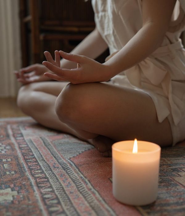 Woman in a calm yoga pose symbolizing focus and balance.